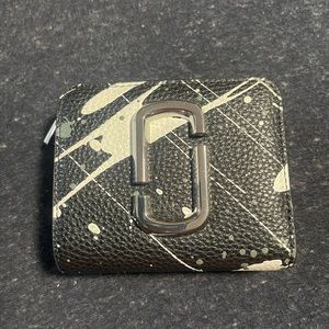 Marc Jacob’s Snap Shot paint splatter wallet.